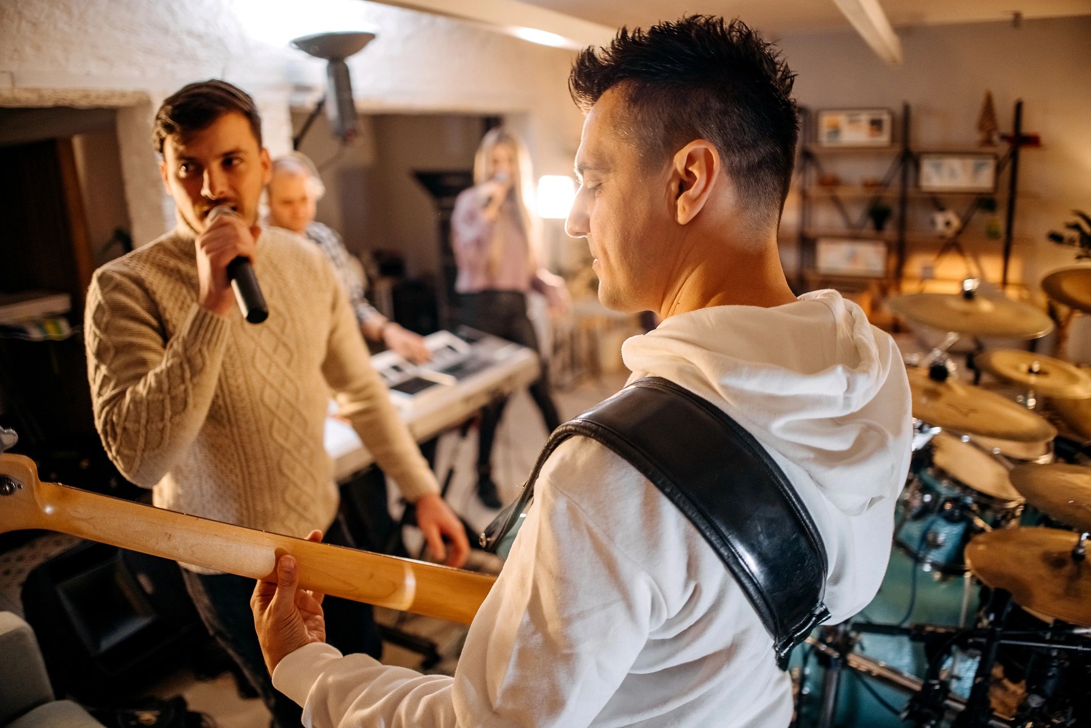 Band members rehearsing together before a performance
