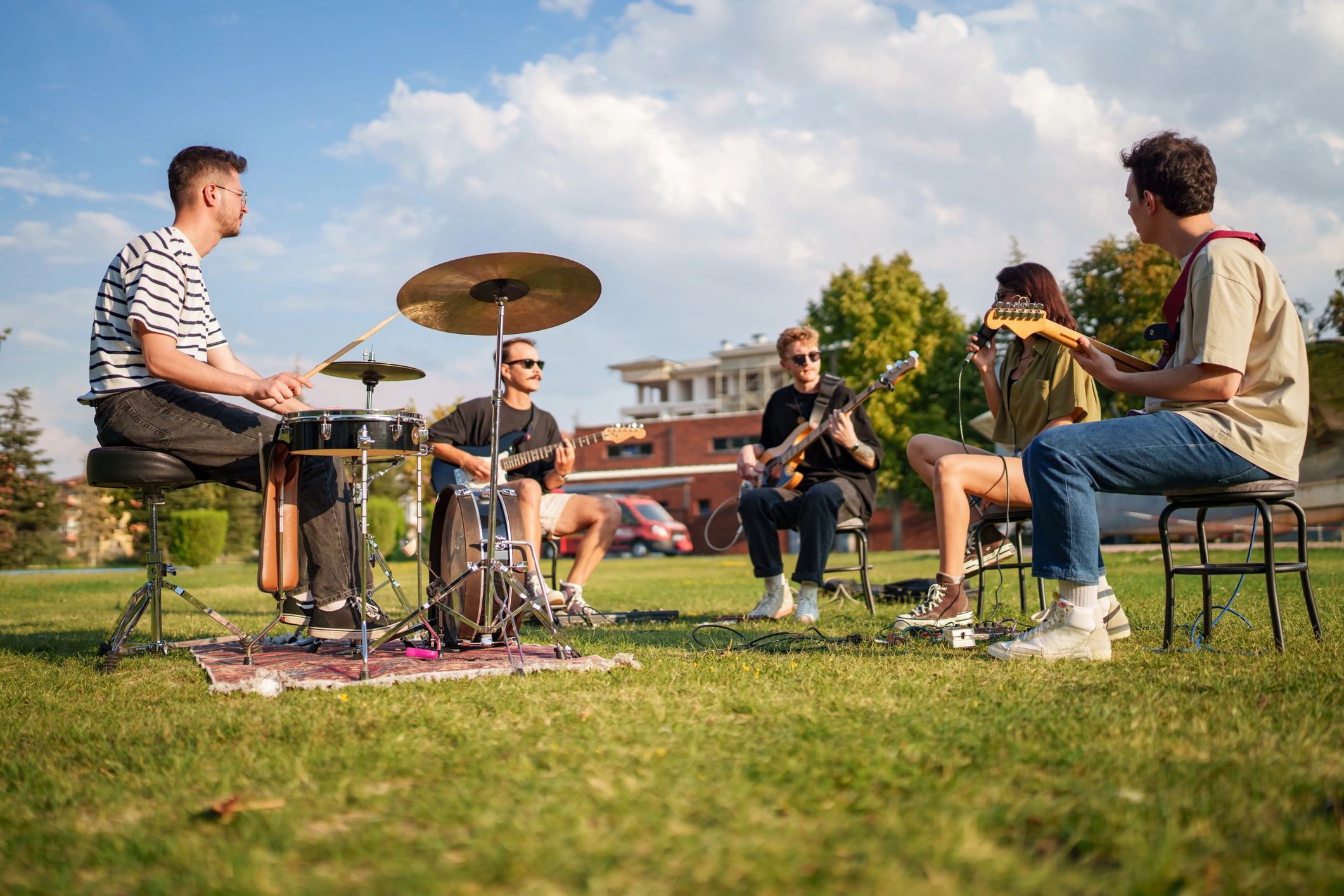 Music group rehearsing outdoors